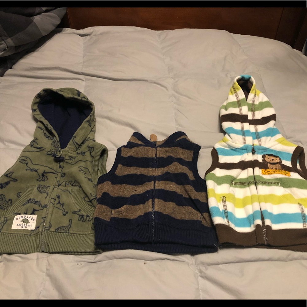 3 Fleece zip up vests. Carter’s newborn size